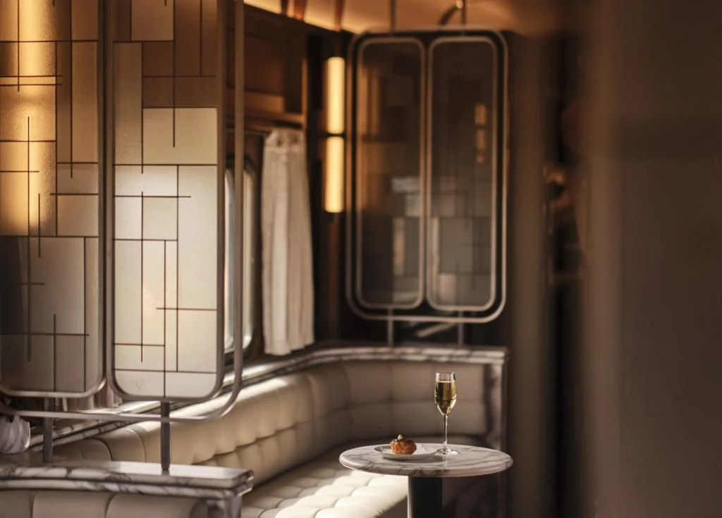 Bronze inlays and textured glass create privacy while preserving light and connection. Photography by Rhiannon Taylor.